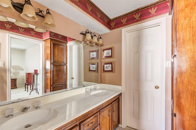 735 Angelina Dr, Conroe, TX 77302 - full bathroom with double vanity, a textured ceiling, and a sink