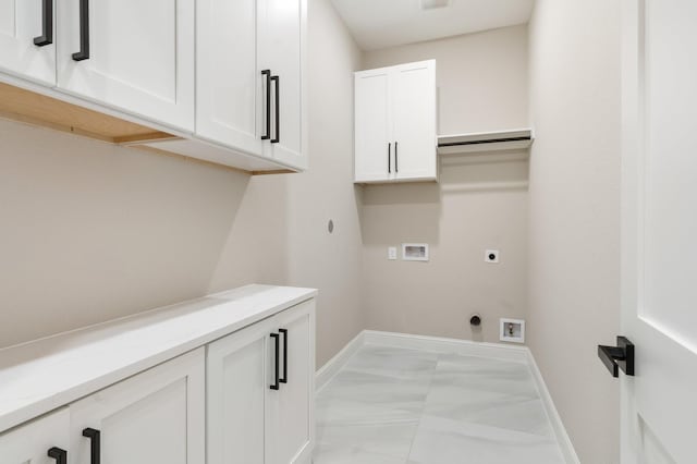 laundry room with hookup for a washing machine, hookup for an electric dryer, and cabinets