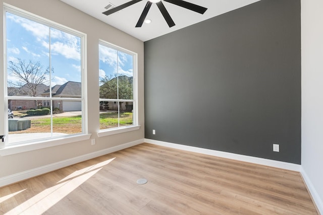 empty room featuring ceiling fan and light wood-type flooring