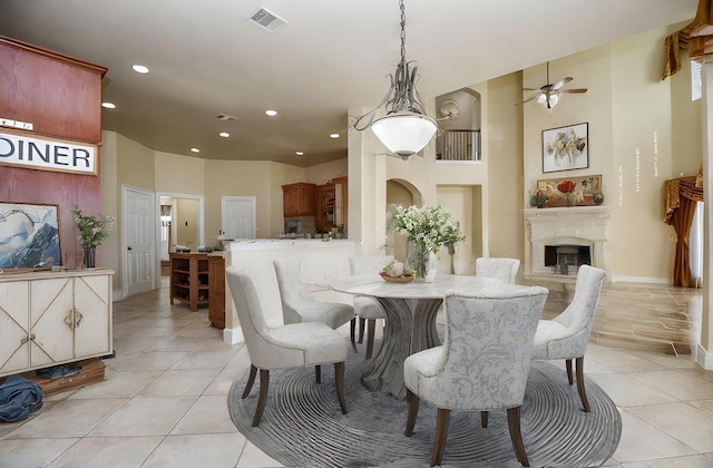 dining space featuring light tile patterned flooring