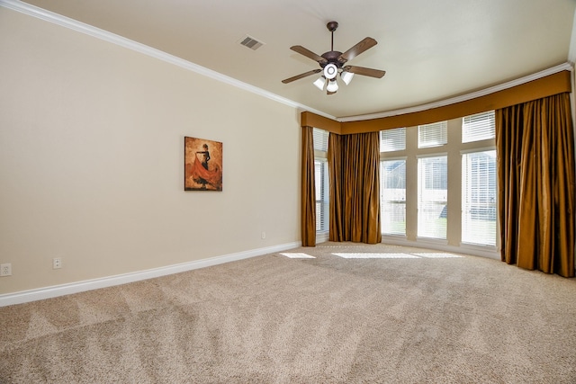 carpeted empty room featuring crown molding and ceiling fan