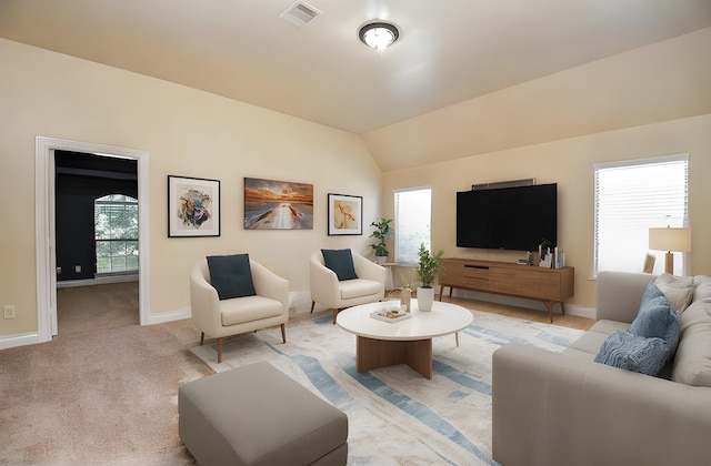 carpeted living room featuring lofted ceiling