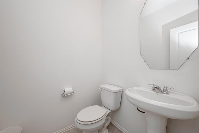 bathroom with toilet and sink