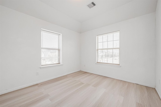 unfurnished room featuring light wood-type flooring