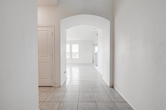 hall with light tile patterned flooring