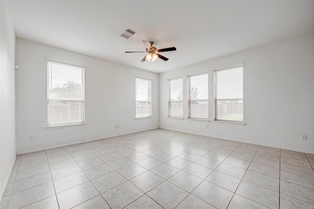 spare room with ceiling fan