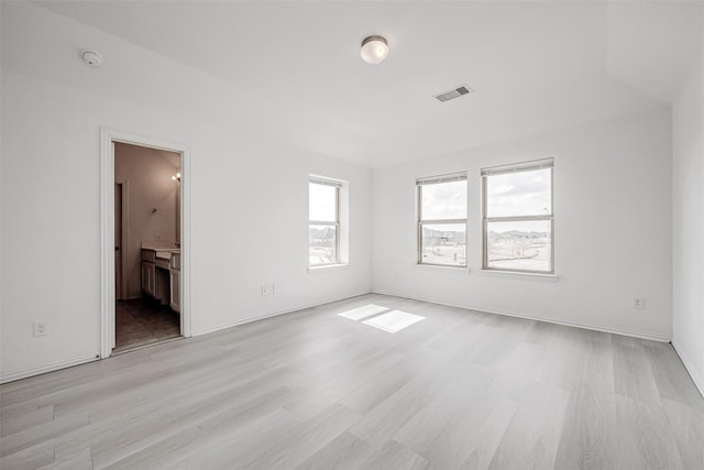 unfurnished room featuring light wood-type flooring