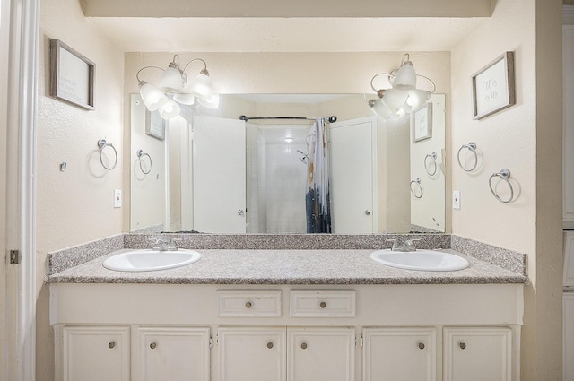 bathroom featuring vanity and a shower with shower door