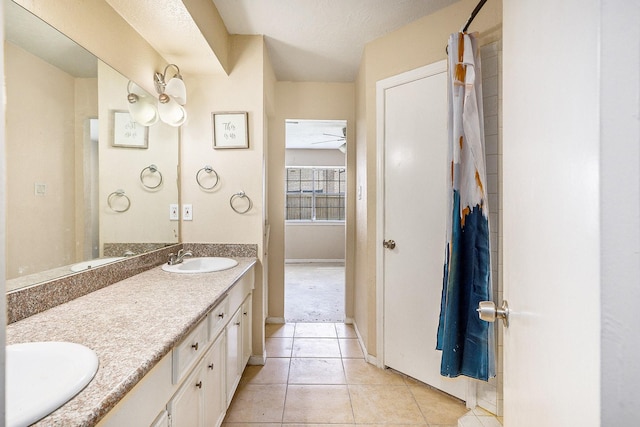 bathroom with tile patterned flooring and vanity