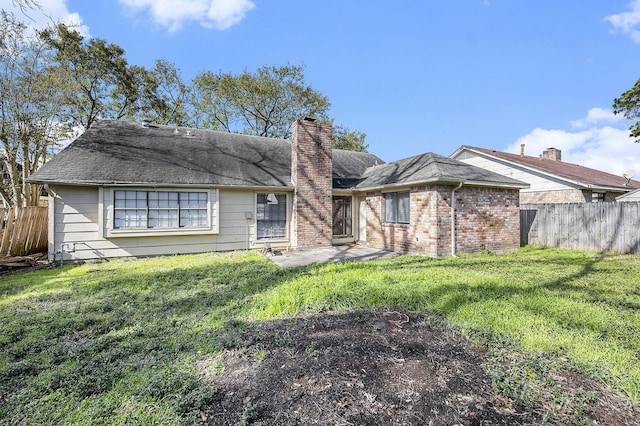 ranch-style home with a patio and a front lawn