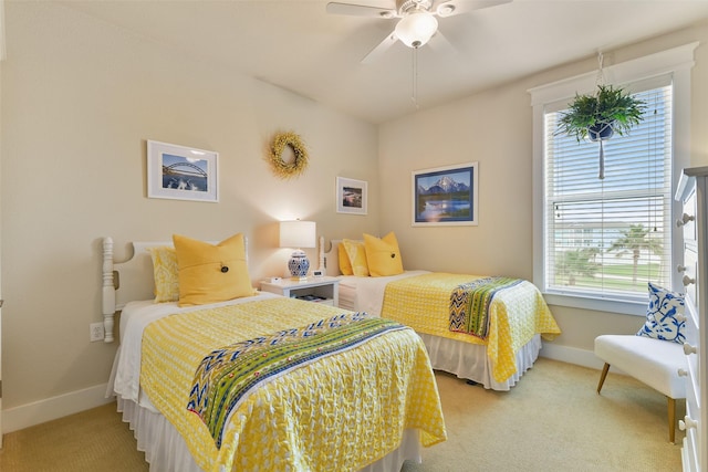 bedroom with light colored carpet and ceiling fan