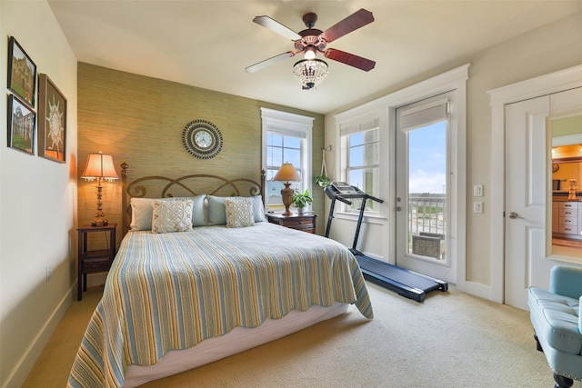 carpeted bedroom featuring access to outside and ceiling fan