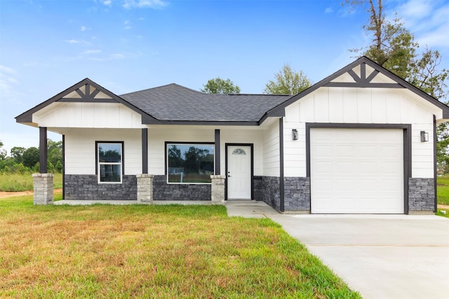 modern farmhouse style home with a garage, a front lawn, and covered porch