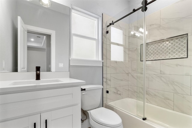 full bathroom with vanity, combined bath / shower with glass door, and toilet