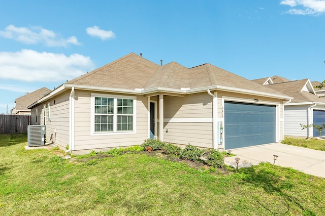 ranch-style home with cooling unit, a garage, and a front lawn