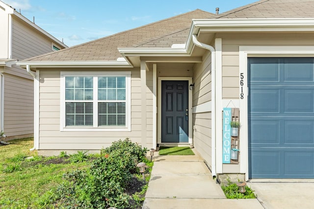 doorway to property featuring a garage