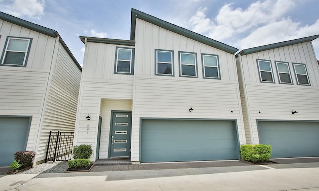 townhome / multi-family property featuring a garage