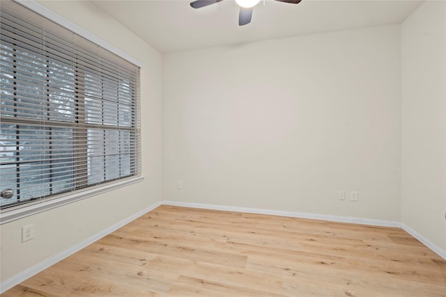 empty room featuring ceiling fan and light wood-type flooring