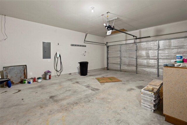 garage featuring a garage door opener and electric panel