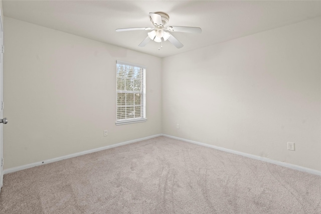 unfurnished room with ceiling fan and light carpet