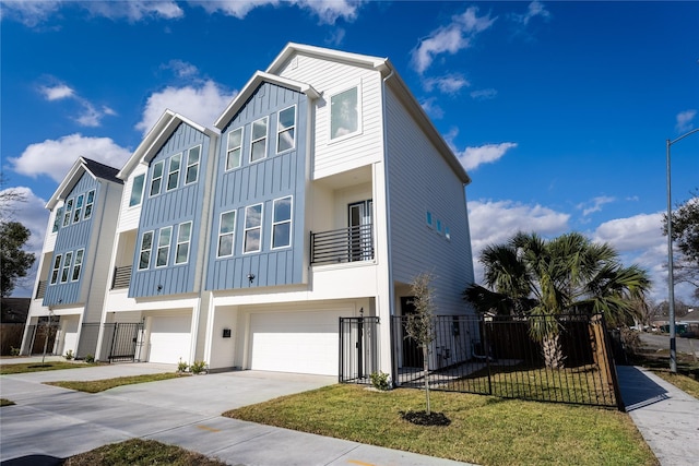 townhome / multi-family property featuring a garage and a front yard