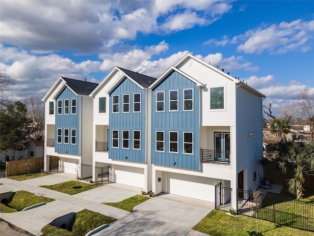 multi unit property featuring a garage