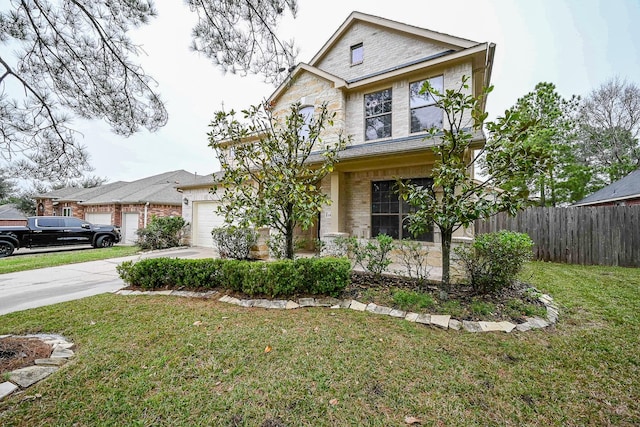 view of front of property featuring a garage and a front yard