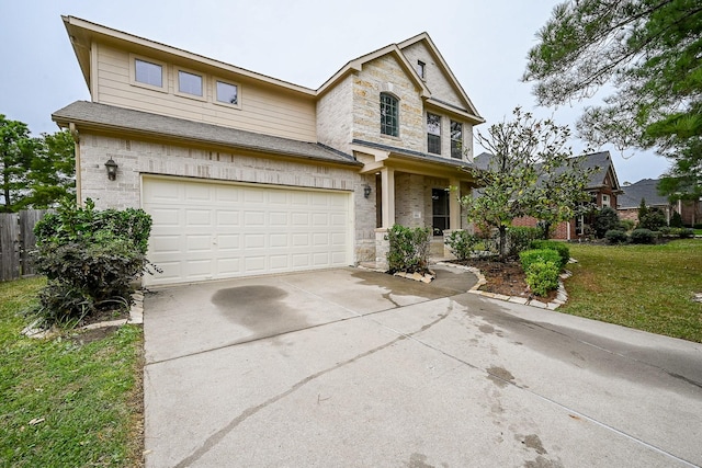 view of front of house featuring a front lawn and a garage