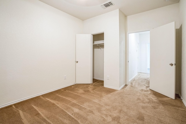 unfurnished bedroom with light colored carpet