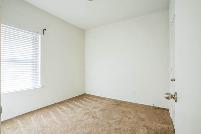 empty room with light colored carpet