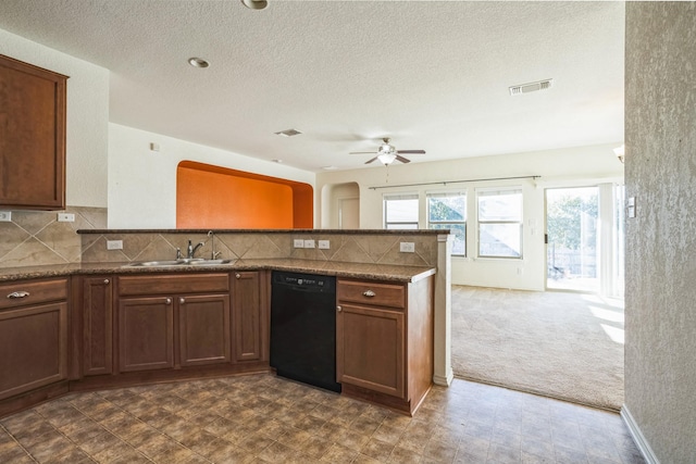 kitchen featuring sink, dishwasher, dark colored carpet, decorative backsplash, and kitchen peninsula