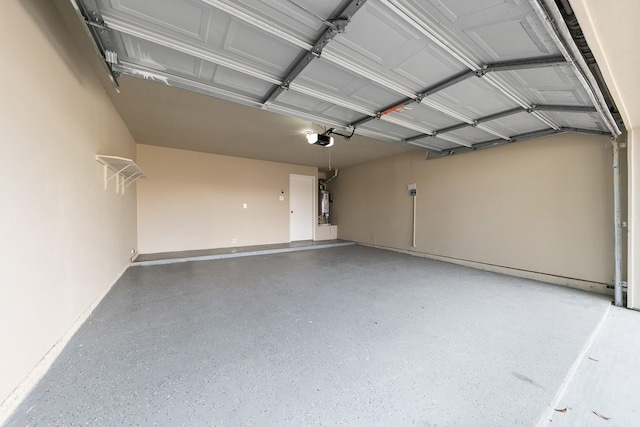 garage featuring a garage door opener and gas water heater