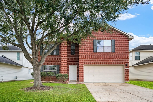 view of front property with a garage and a front yard