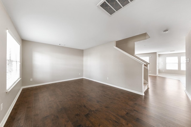 spare room featuring dark hardwood / wood-style floors