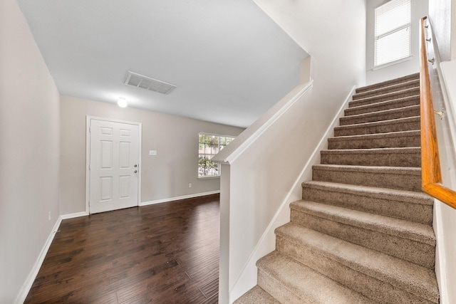 entryway featuring dark wood-type flooring