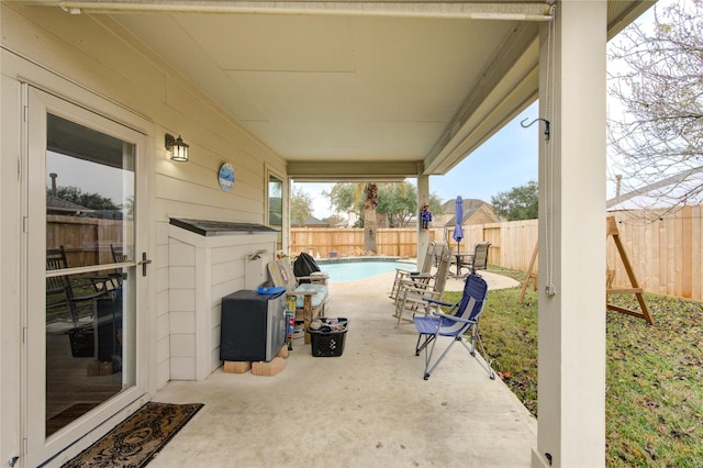 view of patio / terrace featuring a fenced in pool and a fenced backyard