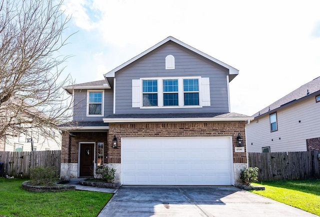 view of front property featuring a garage and a front lawn