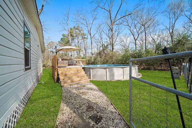 view of yard with a pool side deck