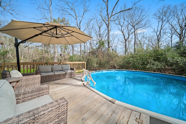 view of pool featuring an outdoor hangout area and a deck