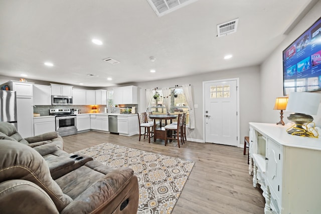 living room featuring light wood-type flooring