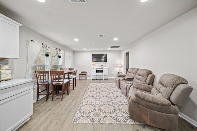 living room with light hardwood / wood-style floors