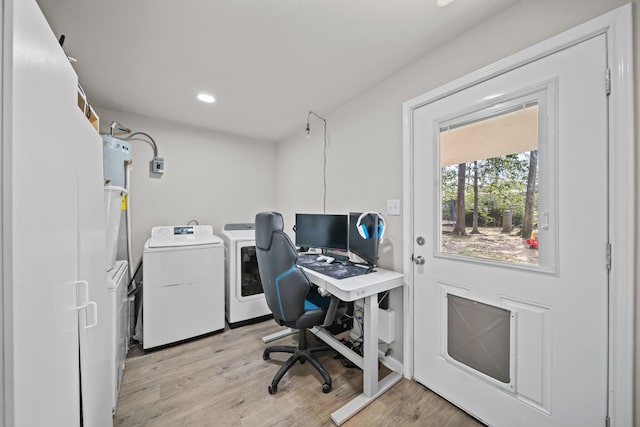 office space with washer and dryer and light wood-type flooring