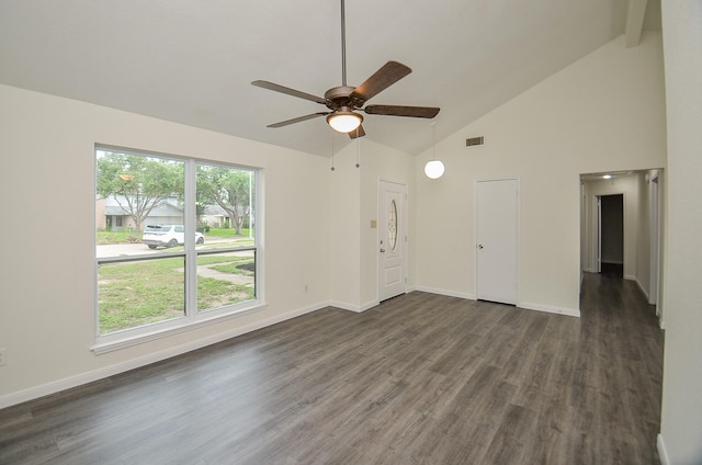 unfurnished living room with ceiling fan, dark wood-type flooring, and high vaulted ceiling