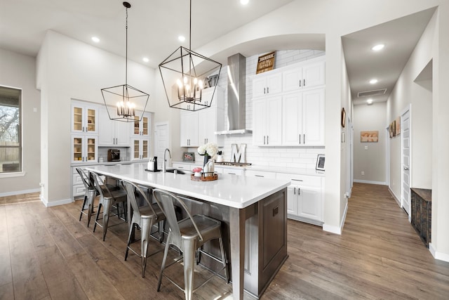 kitchen featuring sink, white cabinets, and a spacious island