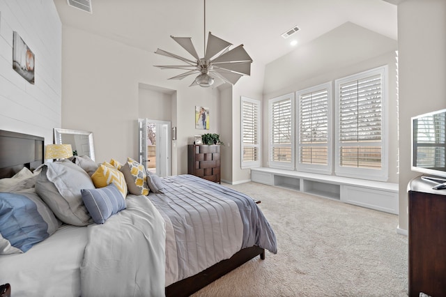 carpeted bedroom with ceiling fan and lofted ceiling