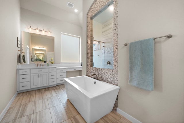 bathroom featuring vanity and a bathtub