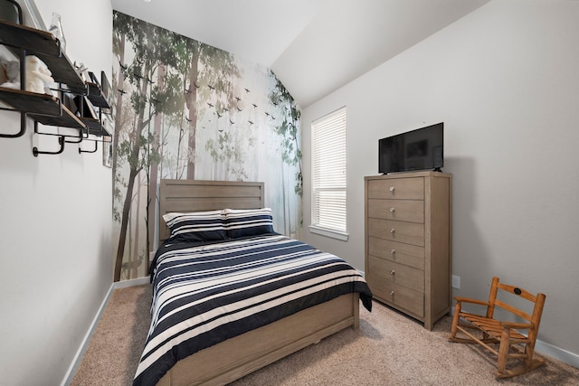 carpeted bedroom with lofted ceiling