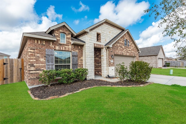 view of front of property with a garage and a front yard