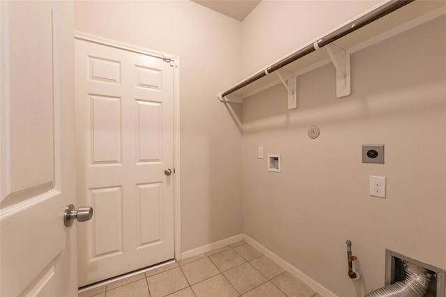 washroom with hookup for a gas dryer, washer hookup, hookup for an electric dryer, and light tile patterned floors