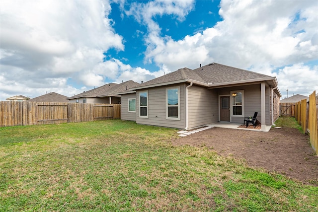 back of property featuring a patio and a lawn